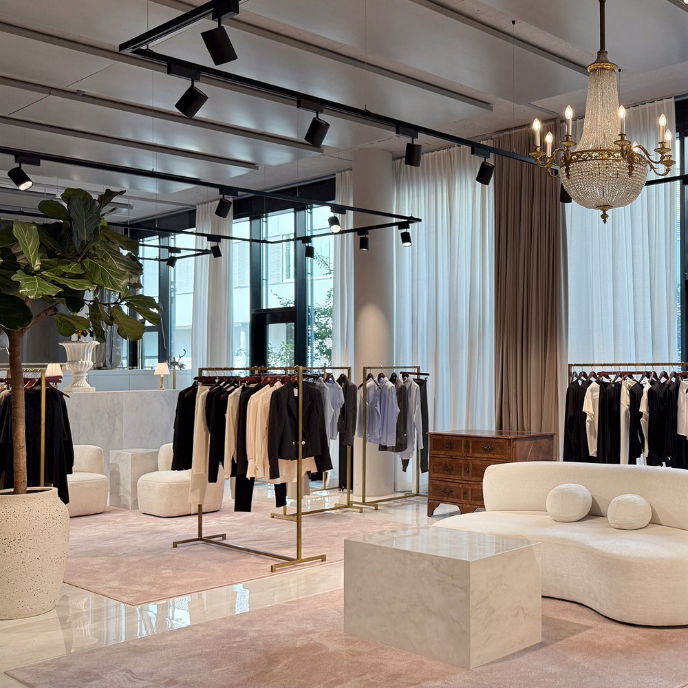 INA KESS Flagshop Store with golden racks containing the beautiful styles from the new INA KESS collection. 