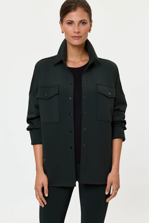 Front view of forest green Ecire oversized shirt jacket with snap buttons and flap chest pockets